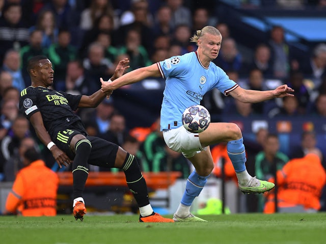 Manchester City's Erling Braut Haaland in action with Real Madrid's David Alaba on May 17, 2023