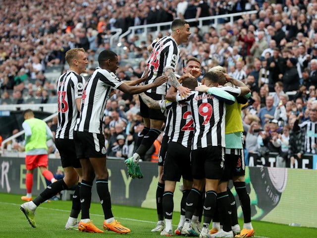 Newcastle United players celebrate an own goal scored by Brighton & Hove Albion's Deniz Undav on May 18, 2023