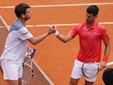 Novak Djokovic and Cameron Norrie shake hands after their Italian Open match on May 16, 2023