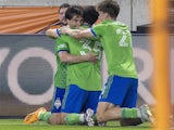 Seattle Sounders midfielder Paul Rothrock (35) celebrates his goal with teammates on May 13, 2023