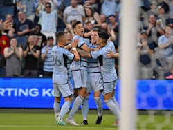 Sporting Kansas City midfielder Erik Thommy (26), midfielder Remi Walter (54) and forward Daniel Salloi (20), and forward Alan Pulido (9) celebrate after a goal on May 13, 2023