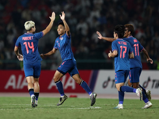 Thailand's Anan Yodsangwal celebrates scoring their first goal with teammates on May 16, 2023