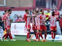 FC Union Berlin's Kevin Behrens celebrates scoring their first goal with teammates on May 13, 2023