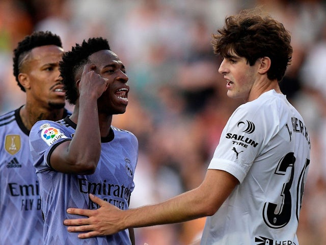  Real Madrid's Vinicius Junior reacts as Valencia's Javi Guerra attempts to talk to him on May 21, 2023