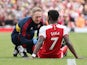Arsenal's Bukayo Saka receives treatment for an injury on May 28, 2023