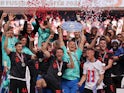 Bayern Munich's Manuel Neuer celebrates with the trophy and teammates after winning the Bundesliga on May 27, 2023