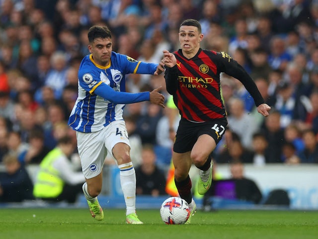 Manchester City's Phil Foden in action with Brighton & Hove Albion's Facundo Buonanotte on May 24, 2023