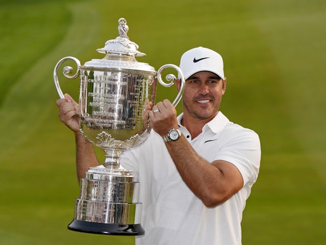 Brooks Koepka poses with the Wanamaker Trophy after winning the PGA Championship golf tournament at Oak Hill Country Club on May 21, 2023