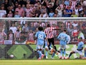 Ethan Pinnock scores for Brentford against Manchester City on May 28, 2023