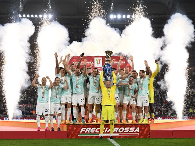Inter Milan players celebrate with the trophy after winning the Coppa Italia on May 24, 2023