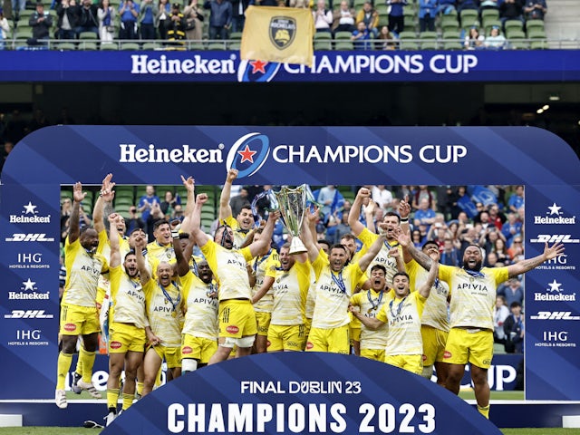 La Rochelle players lift the trophy to celebrate winning the European Champions Cup on May 20, 2023