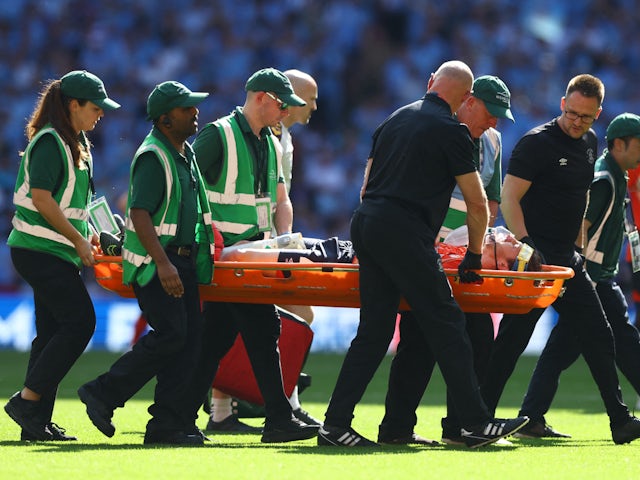 Luton Town's Tom Lockyer is carried away in a stretcher on May 27, 2023