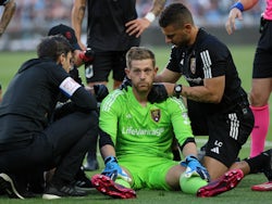 Real Salt Lake goalkeeper Zac MacMath (18) is checked after a collision on May 28, 2023