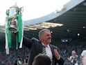 Celtic manager Ange Postecoglou celebrates with the trophy after winning the Scottish Cup on June 3, 2023