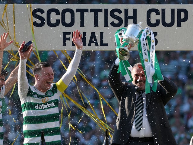 Celtic manager Ange Postecoglou celebrates with the trophy and Callum McGregor after winning the Scottish Cup on June 3, 2023
