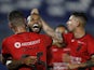Athletico Paranaense's Romulo celebrates scoring their first goal with teammates on May 24, 2023