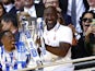 Sheffield Wednesday manager Darren Moore celebrates with the trophy after winning the League One Playoff final on May 29, 2023