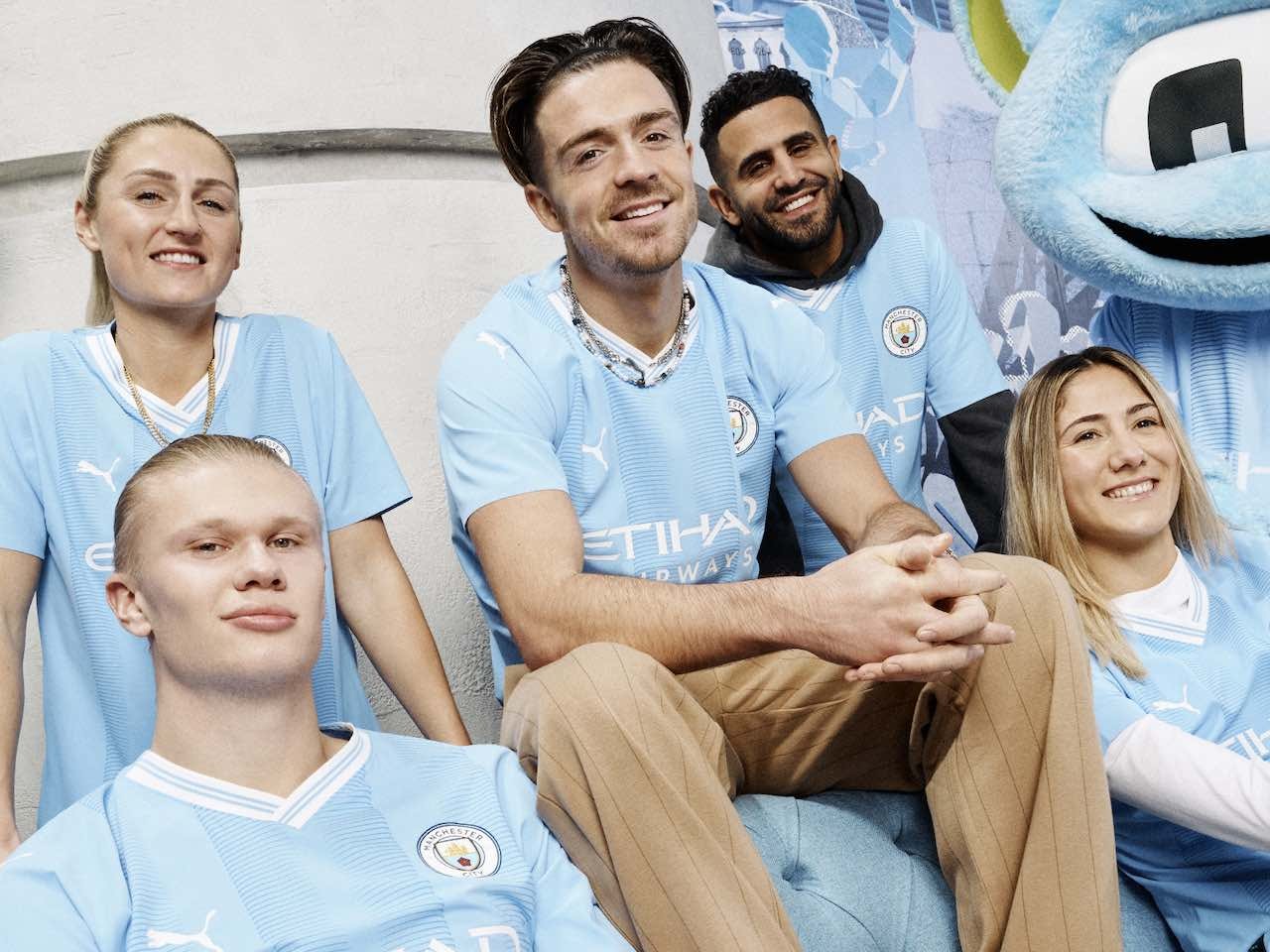 Pictured: Erling Braut Haaland, Jack Grealish model Manchester City 2023-24 home kit