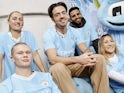 Erling Braut Haaland and Jack Grealish in Man City's 2023-24 home kit