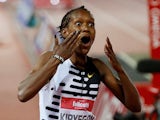 Faith Kipyegon reacts after breaking the 1500m world record on June 2, 2023