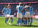 Manchester City players celebrate Ilkay Gundogan's goal against Manchester United on June 3, 2023