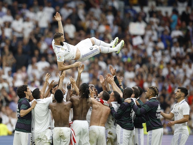 Real Madrid players throw Karim Benzema in the air after the match on June 4, 2023