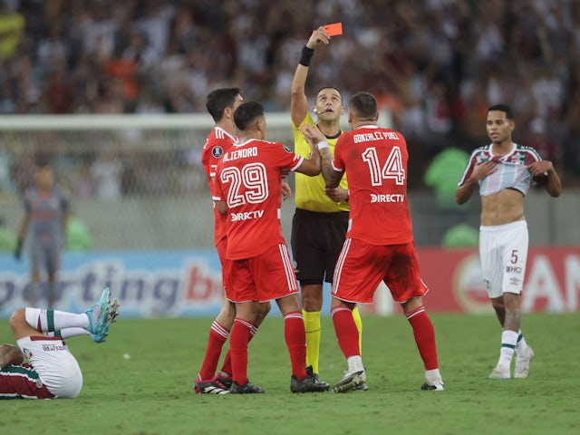 River Plate's Leandro Gonzalez Pirez is shown a red card by referee Esteban Ostojich on May 4, 2023