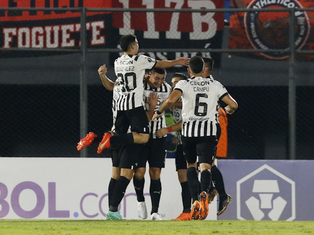 Libertad's Oscar Cardoza celebrates scoring their first goal with teammates on May 24, 2023