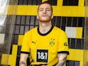 Marco Reus models the Dortmund 2023-24 home kit