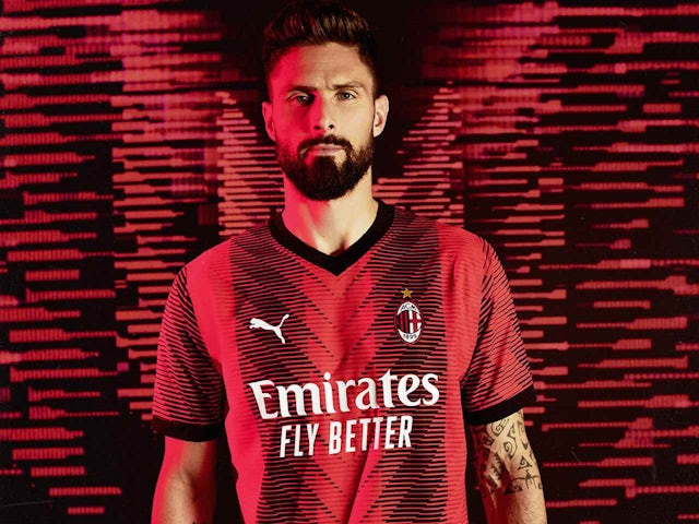 Olivier Giroud models the AC Milan 2023-24 home kit