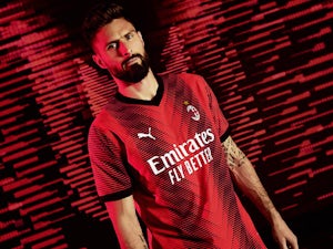 Pictured: Olivier Giroud models AC Milan 2023-24 home kit