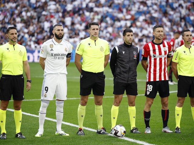Real Madrid's Karim Benzema amd Athletic Bilbao's Oscar de Marcos line up before their match on June 4, 2023