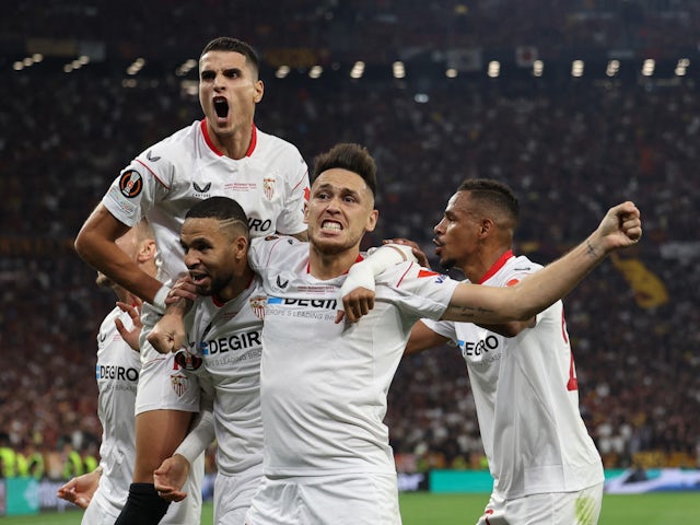 Sevilla's Erik Lamela, Youssef En-Nesyri and Lucas Ocampos celebrate a goal against Roma on May 31, 2023