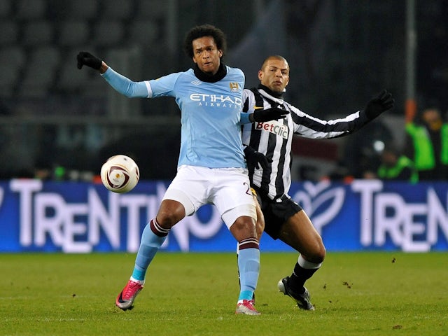 Manchester City's Jo in action with Juventus' Felipe Melo on December 16, 2010