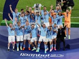 Manchester City players celebrate lifting the Champions League trophy on June 10, 2023