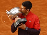 Serbia's Novak Djokovic kisses the trophy after winning the French Open on June 11, 2023