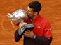 Serbia's Novak Djokovic kisses the trophy after winning the French Open on June 11, 2023