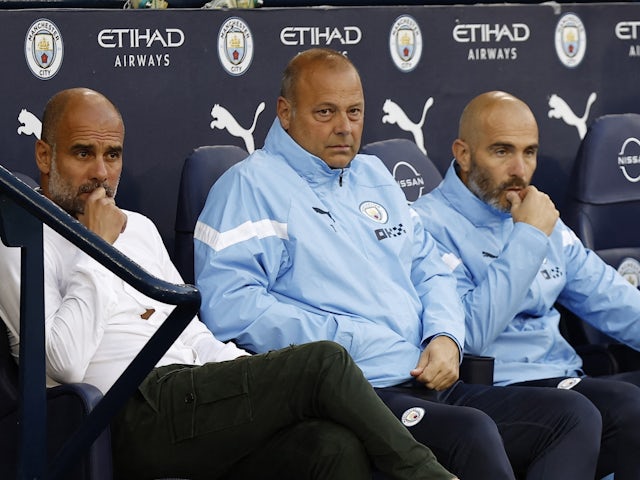 Manchester City manager Pep Guardiola sat alongside assistant coaches Rodolfo Borrell and Enzo Maresca before the match on August 31, 2022