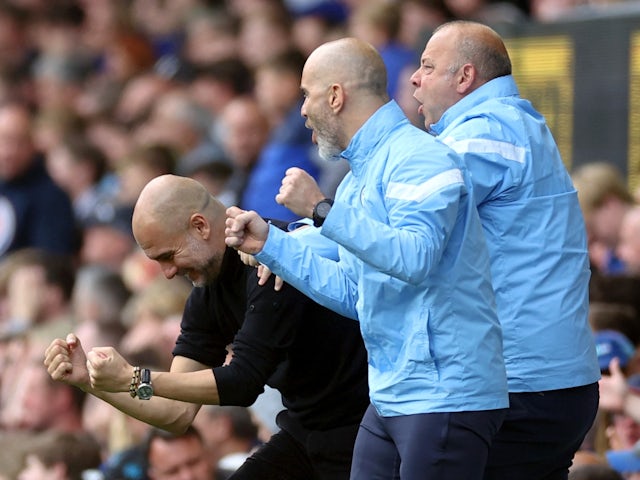 Manchester City manager Pep Guardiola celebrates their third goal with assistant manager Rodolfo Borrell and coach Enzo Maresca  on May 14, 2023