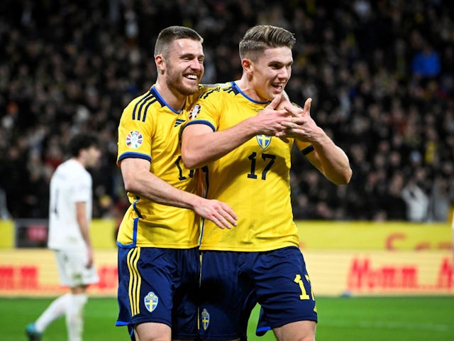 Sweden's Viktor Gyokeres celebrates scoring their third goal with Mattias Svanberg on March 27, 2023