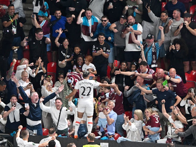 West Ham United's Said Benrahma celebrates scoring their first goal with teammates and fans on June 7, 2023