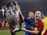 Barcelona's Andres Iniesta celebrates with the Champions League trophy in 2009