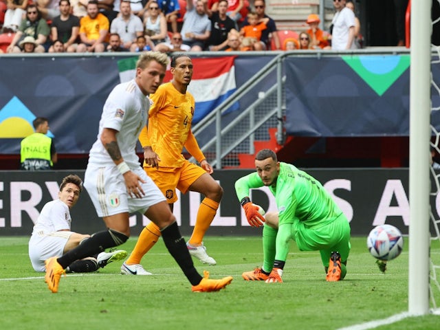 Italy's Federico Chiesa scores their third goal past Netherlands' Justin Bijlow on June 18, 2023