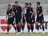 Georgia's Georges Mikautadze celebrates scoring their first goal with teammates on June 17, 2023