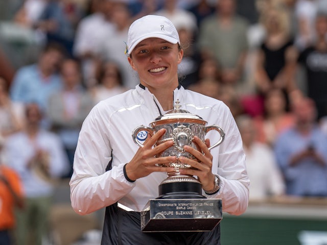 Iga Swiatek (POL) celebrates with the championship trophy after winning the French Open final against Karolina Muchova (CZE) on day 14 at Stade Roland-Garros on June 10, 2023