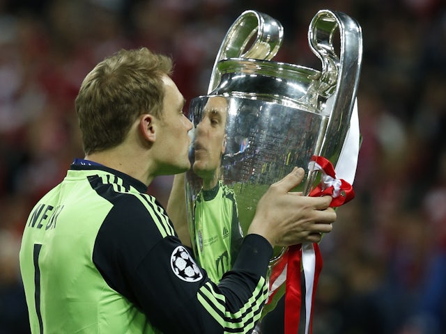 Bayern Munich's goalkeeper Manuel Neuer kisses the trophy after defeating Borussia Dortmund in their Champions League Final soccer match at Wembley Stadium in London May 25, 2013