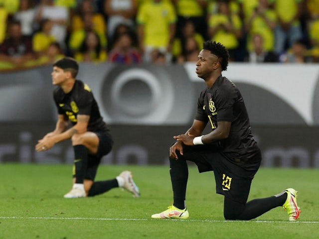 Brazil's Vinicius Junior takes the knee before the match on June 17, 2023