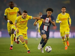 Paris Saint-Germain's Warren Zaire-Emery in action with Nantes' Andrei Girotto on March 4, 2023