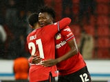 Bayer Leverkusen's Edmond Tapsoba and Amine Adli celebrate after the match on March 9, 2023