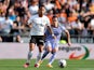 Valencia's Justin Kluivert in action with Real Madrid's Lucas Vazquez on May 21, 2023